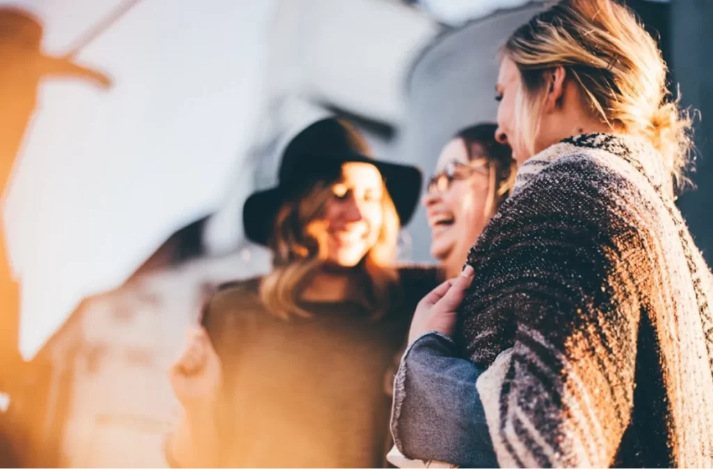 Group laughter representing connected health relationships.