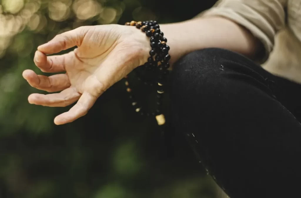 Hand in meditative pose for balance and wellness.