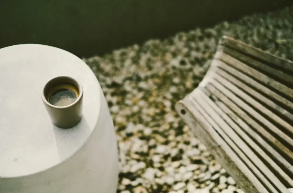 Minimalist coffee cup on modern stone table – shop coffee tables on sale.