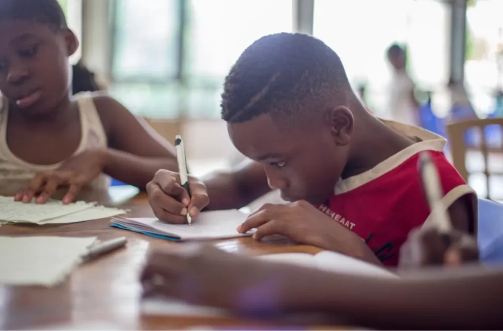 Student writing attentively at CT Tech School.