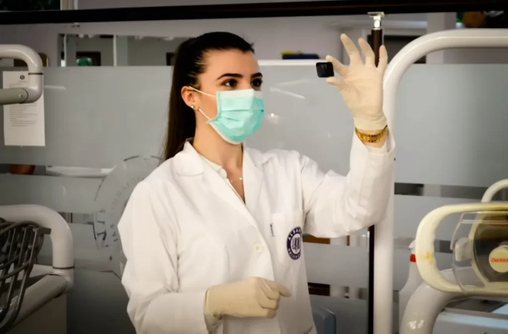 Nurse examining sample in advanced home care setting.
