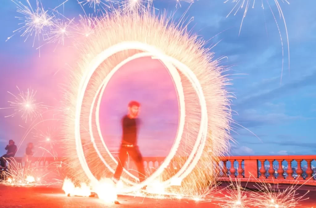 Fire performer creates dazzling light show at why mcw spin weeks.