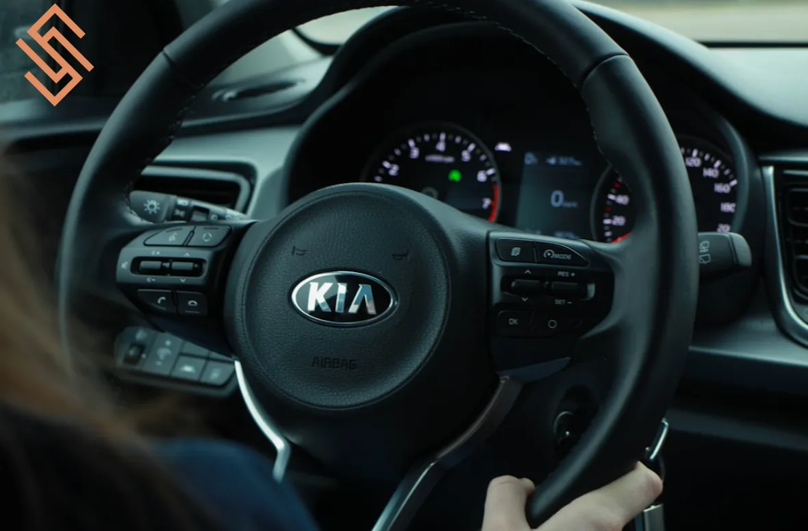 Kia steering wheel, hands on driving experience.