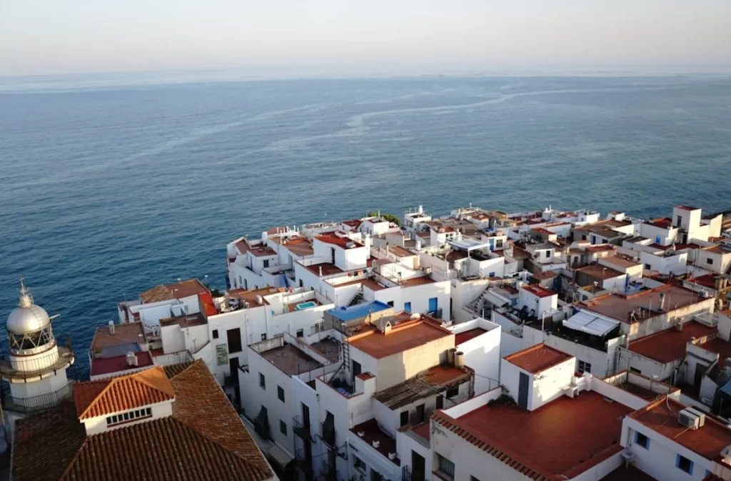 Overlooking whitewashed coastal homes by the ocean.